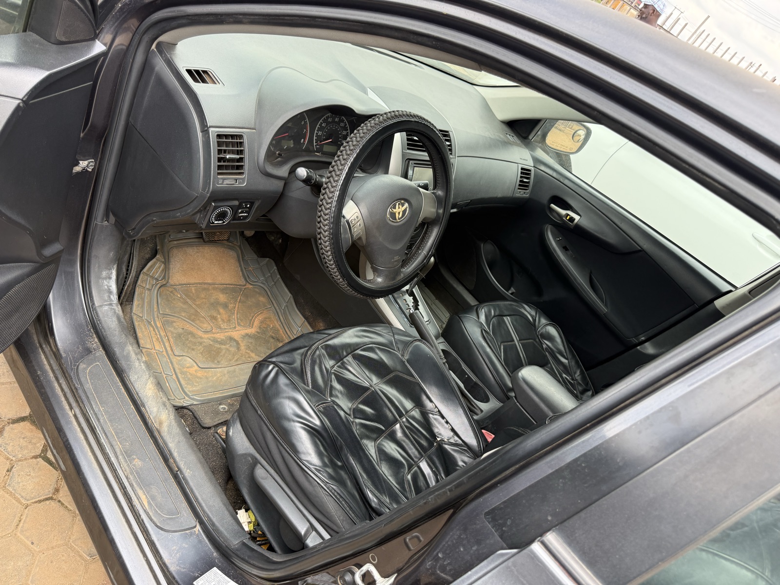 Toyota Corolla, Dark Grey Sedan with Alloy Wheels