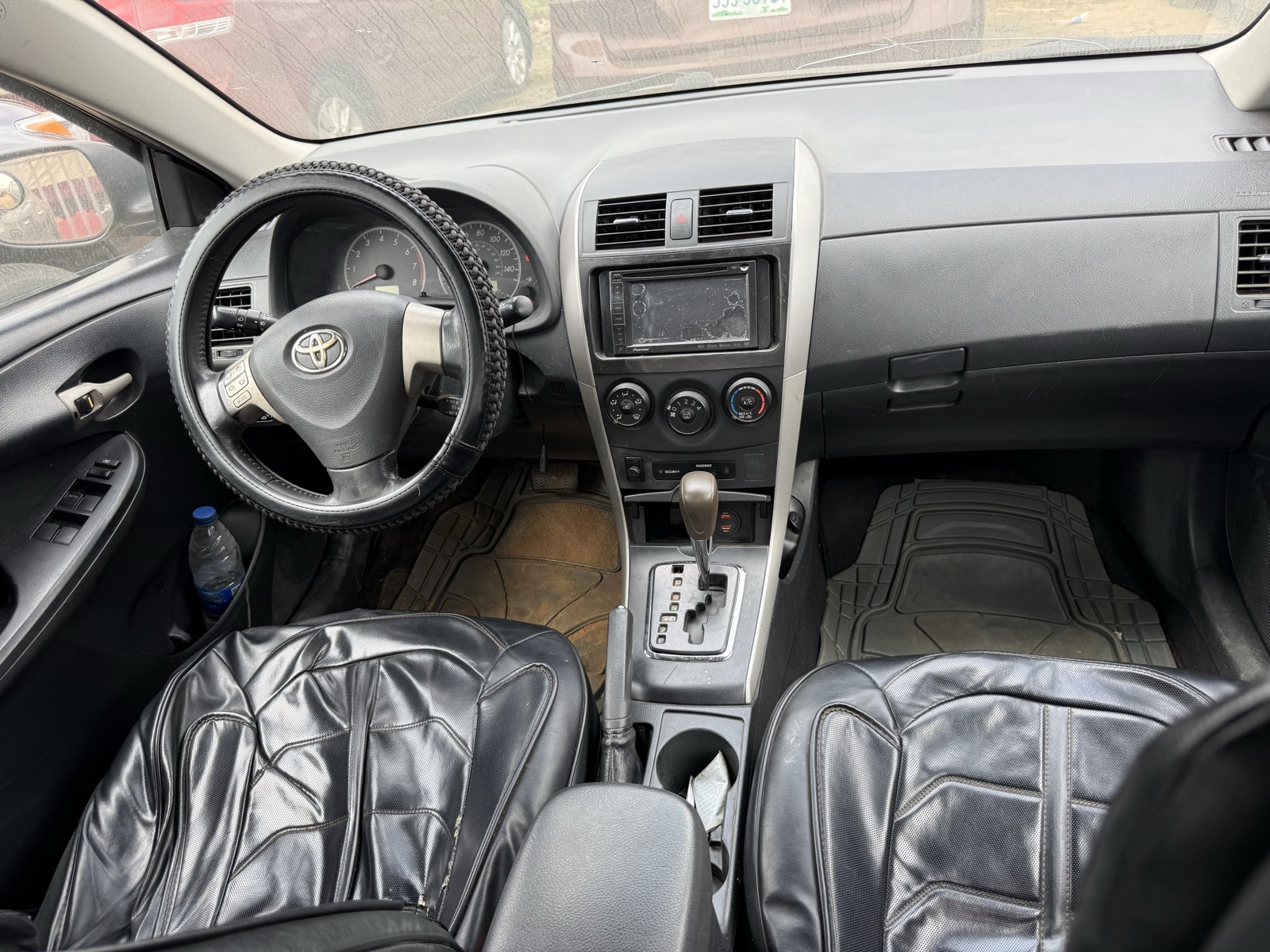 Toyota Corolla, Dark Grey Sedan with Alloy Wheels