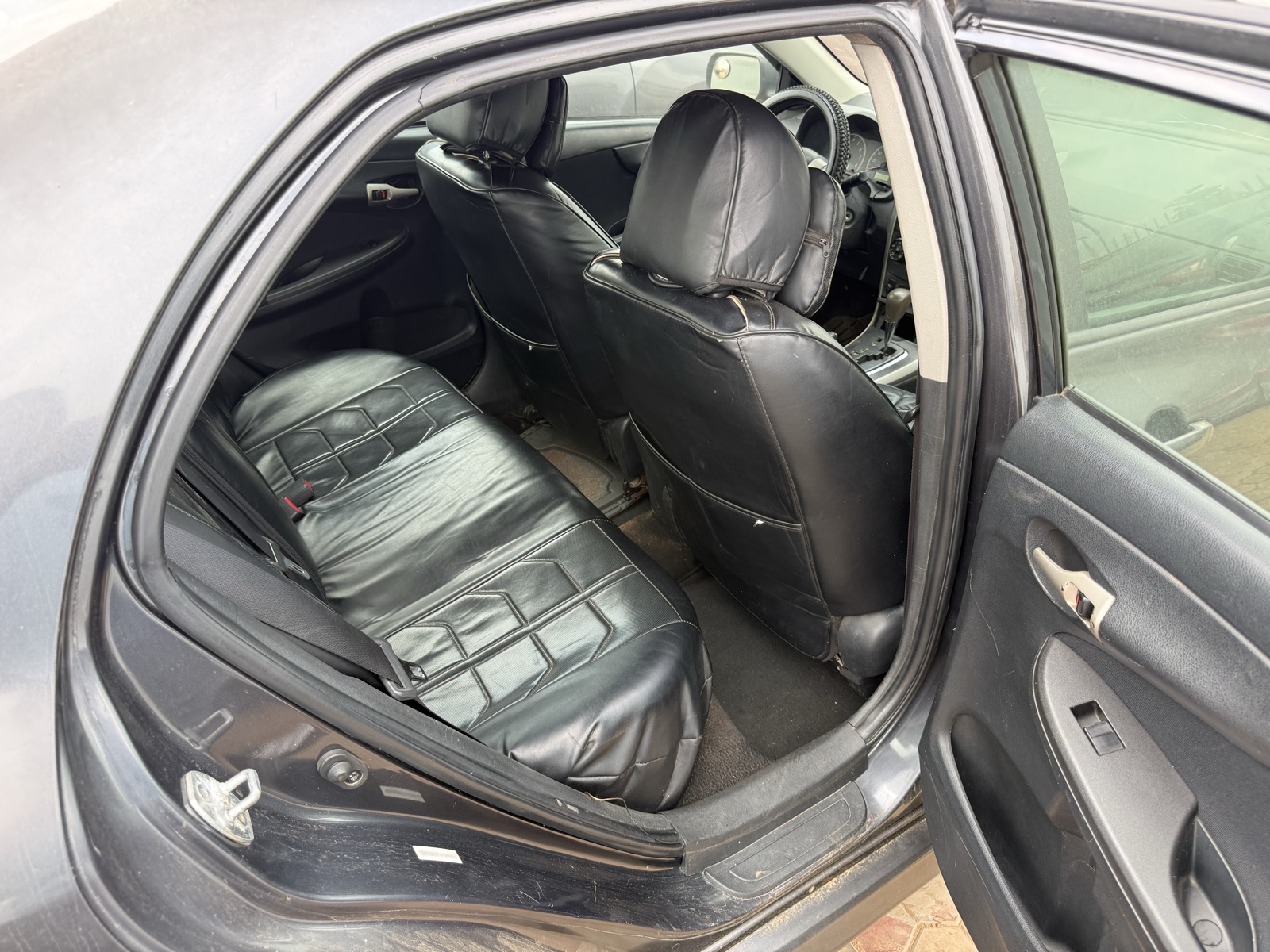 Toyota Corolla, Dark Grey Sedan with Alloy Wheels