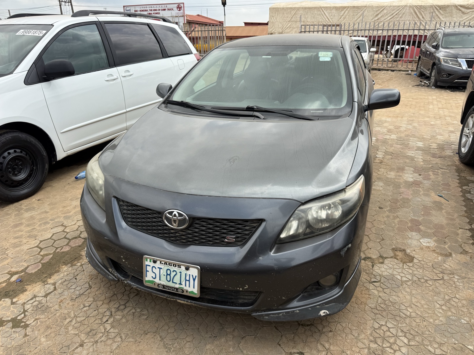 Toyota Corolla, Dark Grey Sedan with Alloy Wheels
