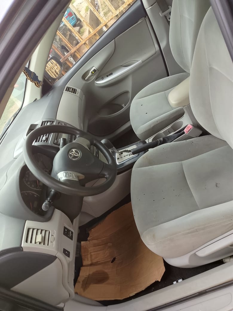 Toyota Corolla, Grey Sedan with Alloy Wheels