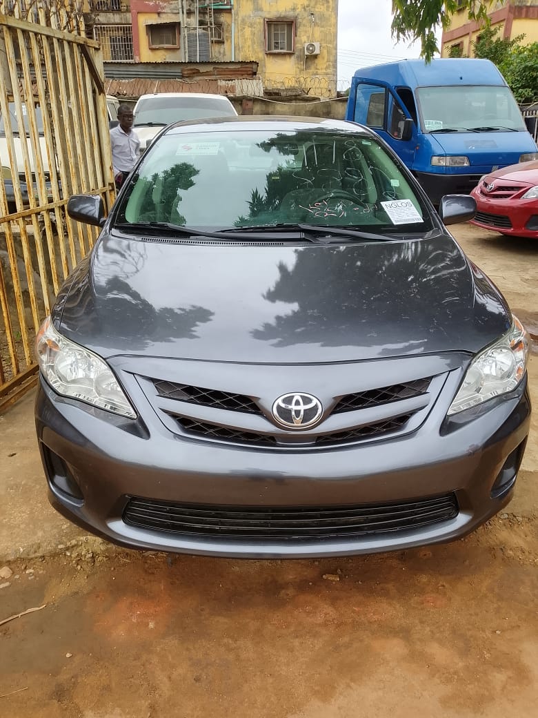Toyota Corolla, Grey Sedan with Alloy Wheels