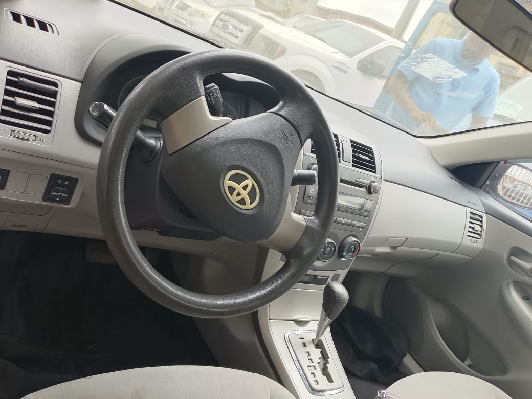 Toyota Corolla, Grey Sedan with Alloy Wheels