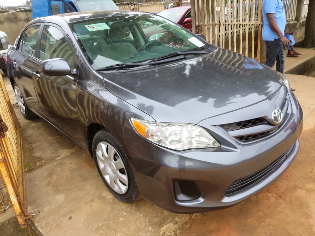 Toyota Corolla, Grey Sedan with Alloy Wheels