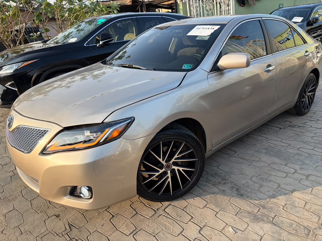 Toyota Camry Gold Sedan with Custom Lights