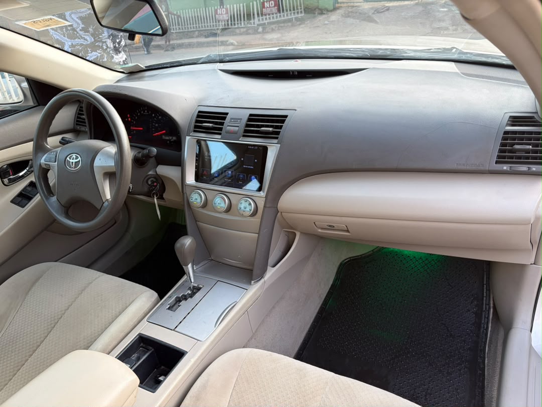 Toyota Camry Gold Sedan with Custom Lights