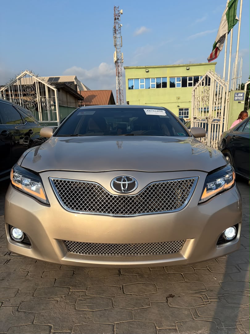 Toyota Camry Gold Sedan with Custom Lights