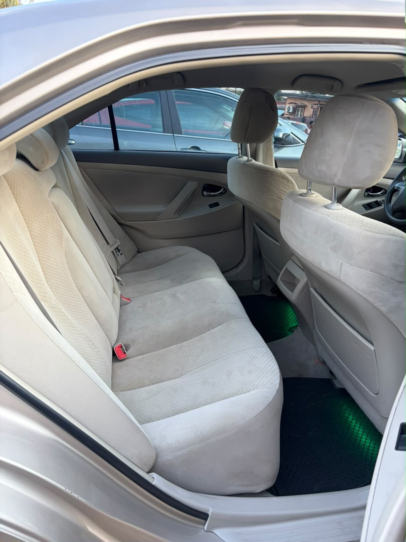 Toyota Camry Gold Sedan with Custom Lights
