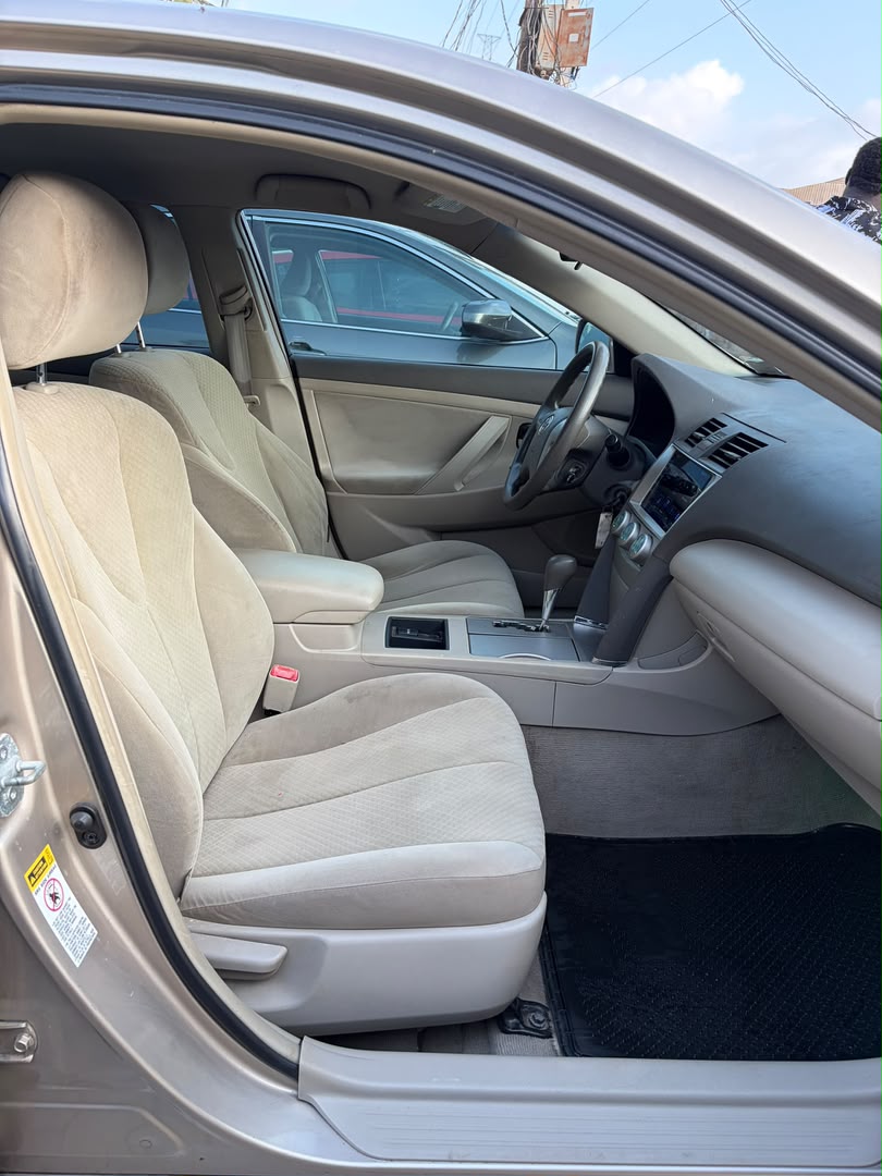 Toyota Camry Gold Sedan with Custom Lights