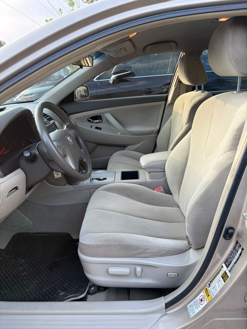 Toyota Camry Gold Sedan with Custom Lights