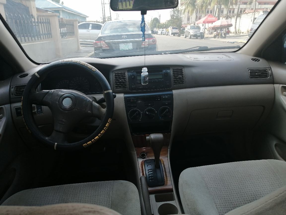 Toyota 20Toyota Corolla Black Sedan with Alloy Wheels
