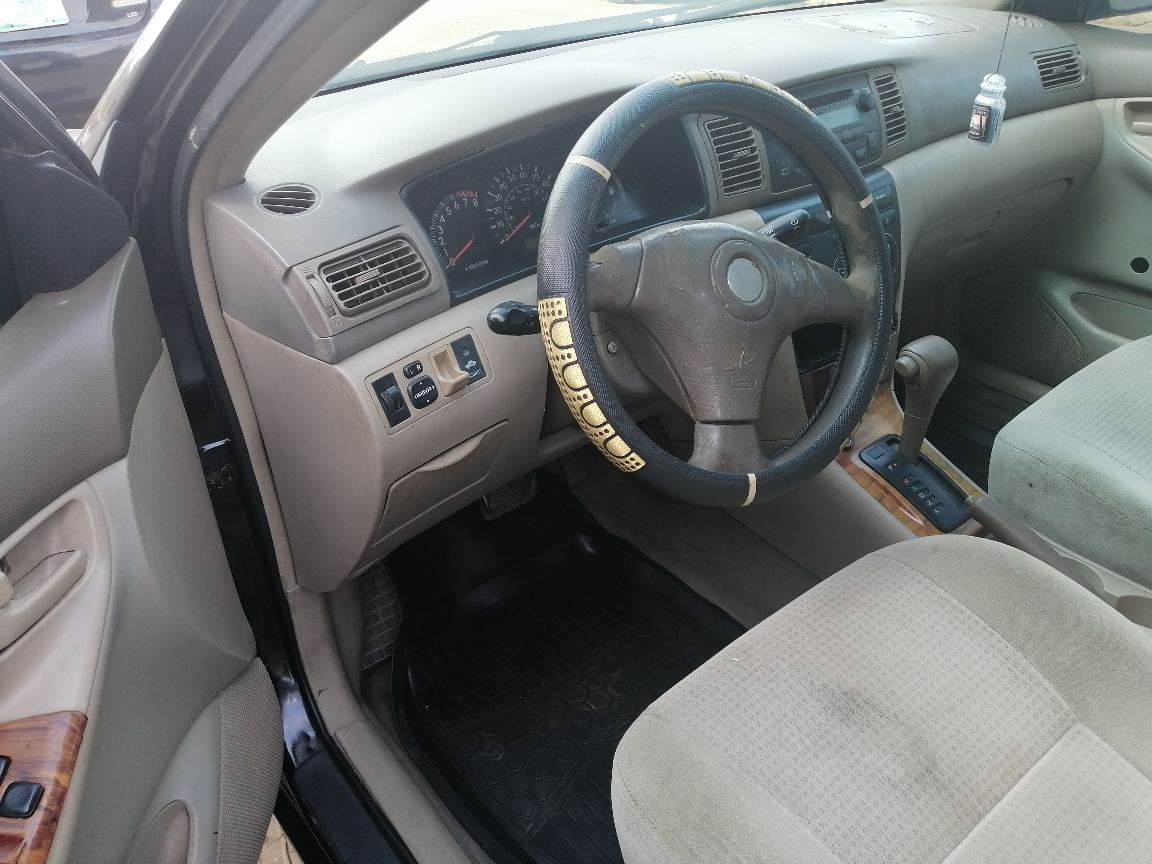 Toyota 20Toyota Corolla Black Sedan with Alloy Wheels
