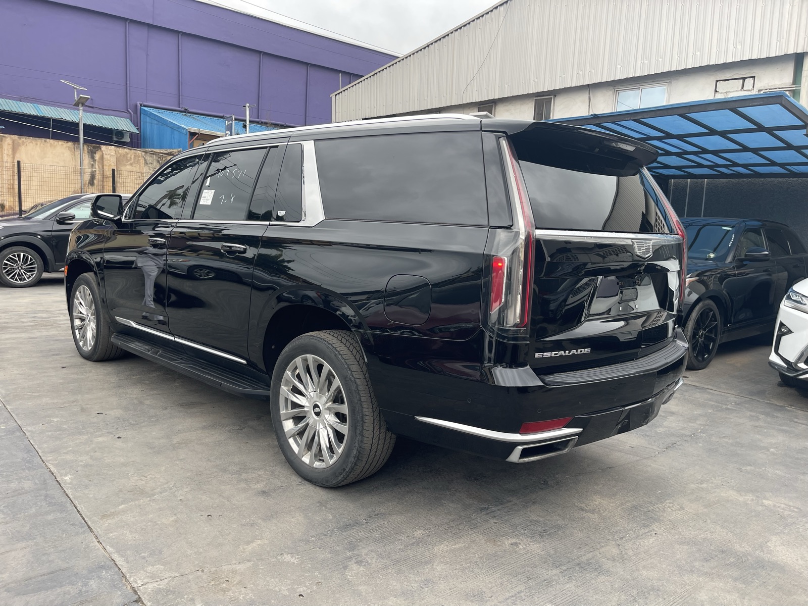 Toks 2021 Cadillac Escalade Black SUV with Chrome Wheels