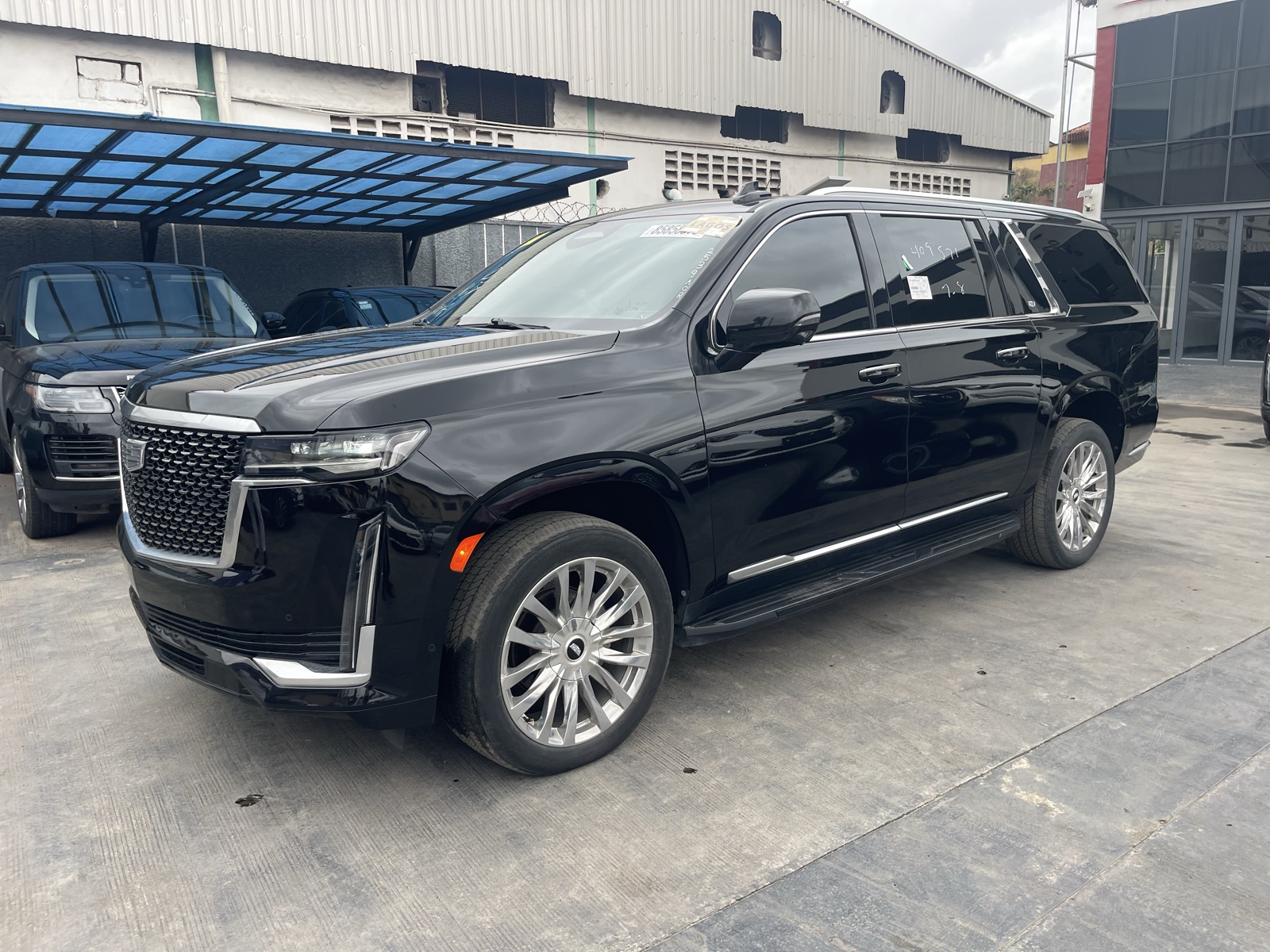 Toks 2021 Cadillac Escalade Black SUV with Chrome Wheels