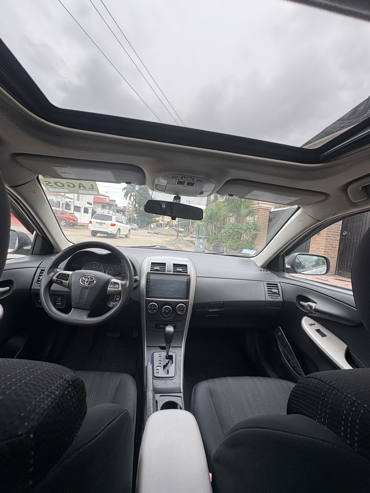 2012 Toyota Corolla Silver Sedan with Spoiler — photo 2