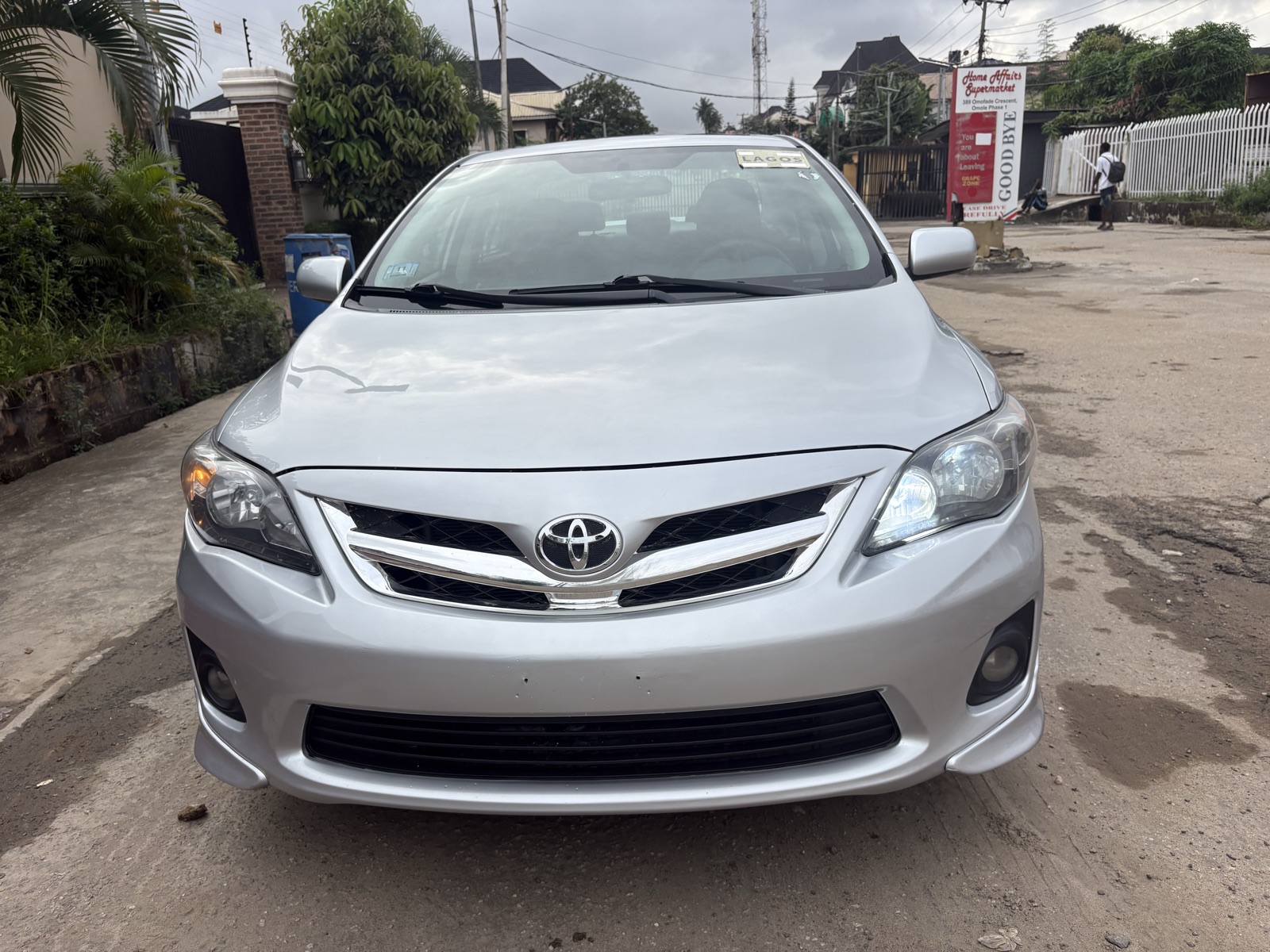 2012 Toyota Corolla Silver Sedan with Spoiler