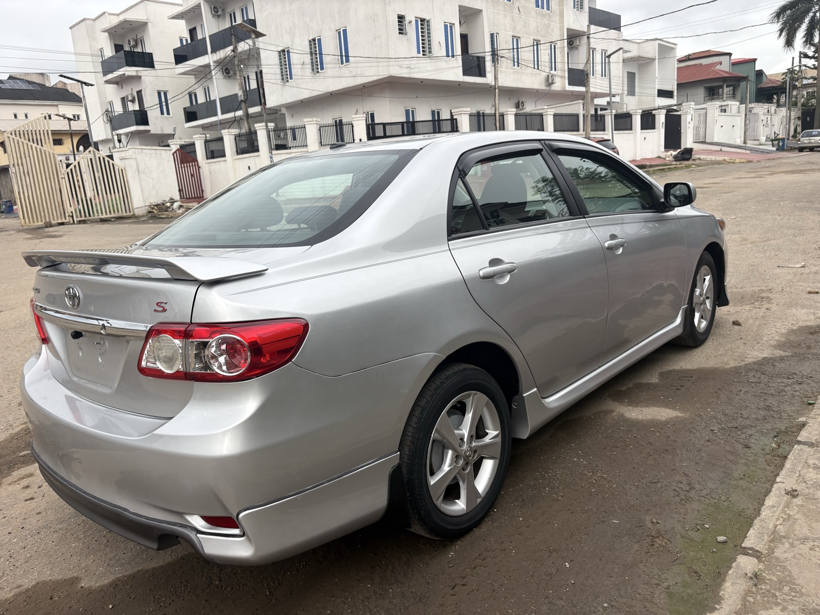 2012 Toyota Corolla Silver Sedan with Spoiler — photo 4