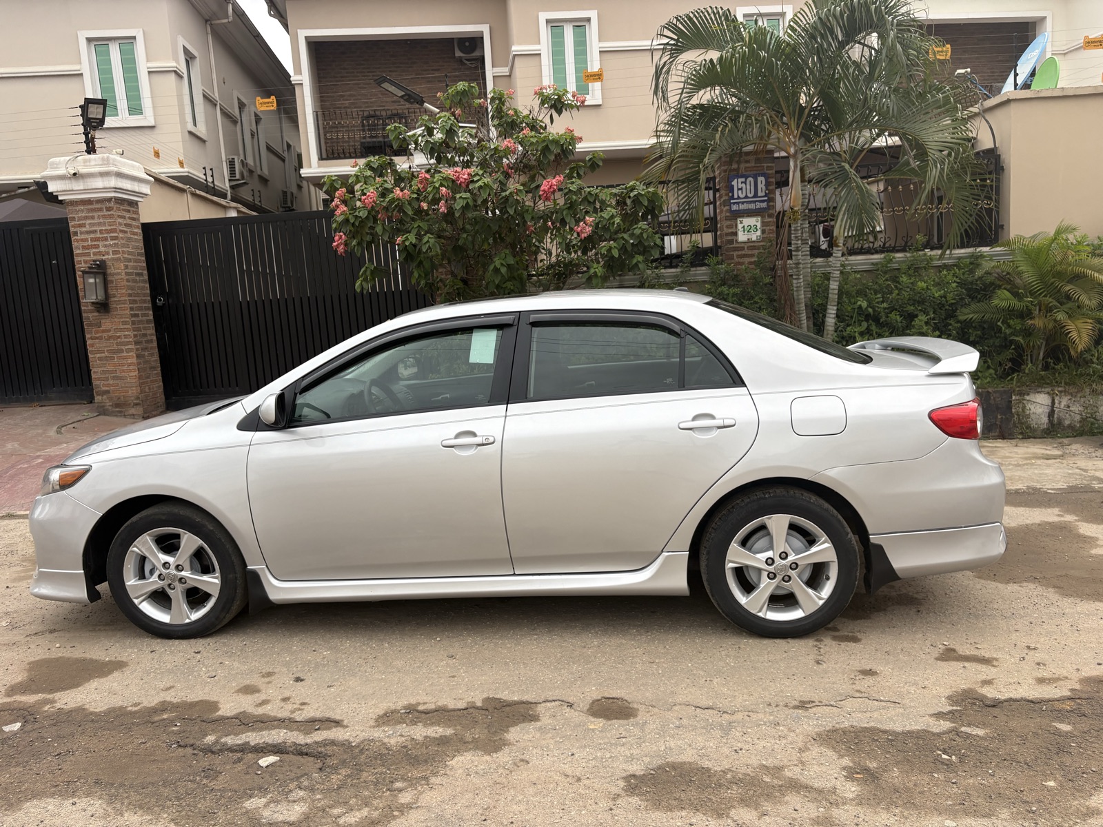 2012 Toyota Corolla Silver Sedan with Spoiler — photo 10