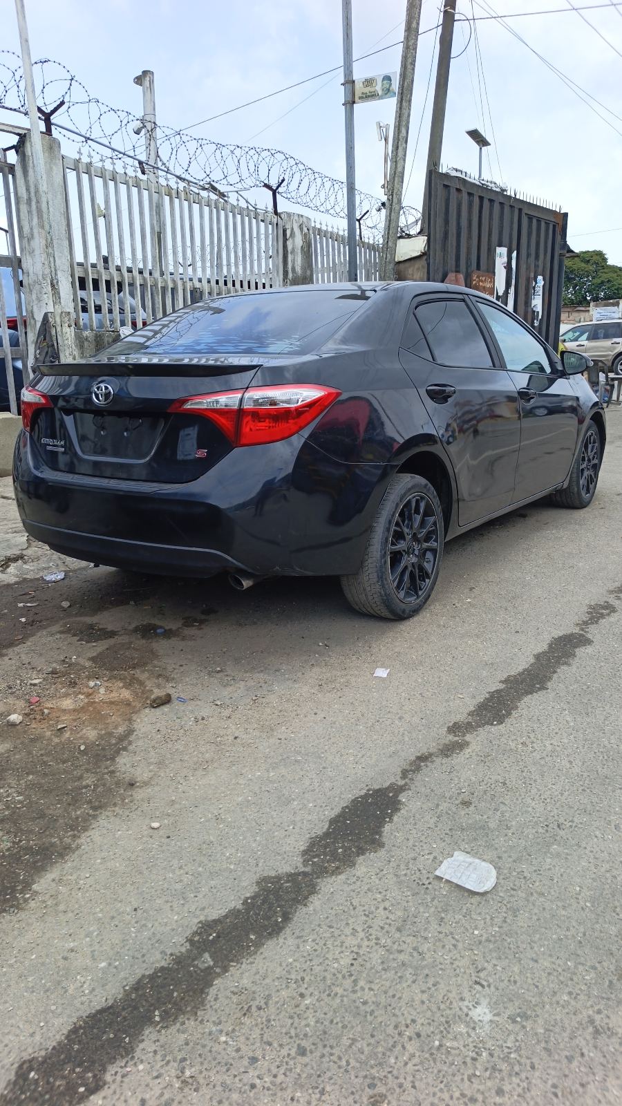 Toyota Corolla S Black Sedan with Alloy Wheels