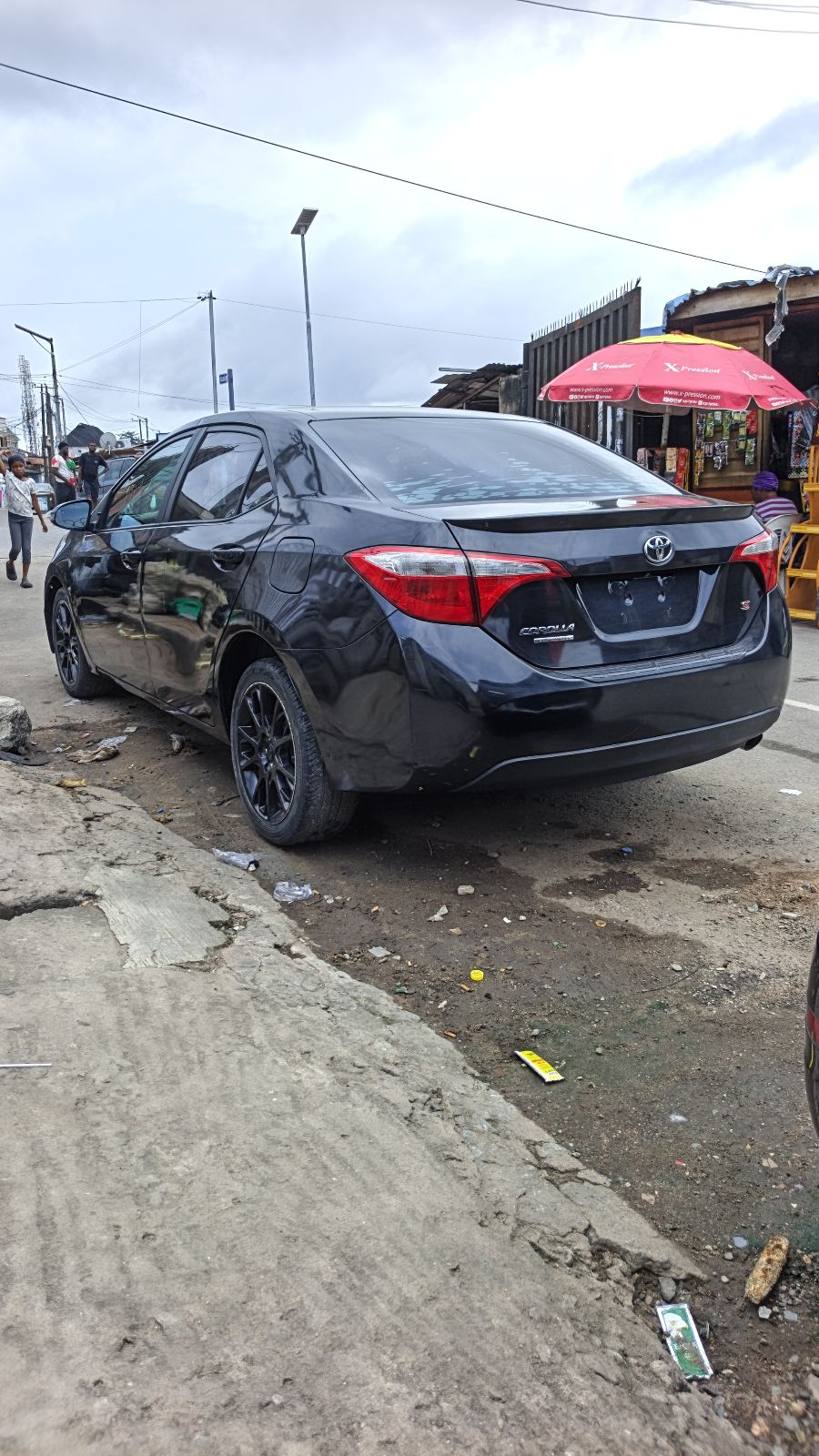 Toyota Corolla S Black Sedan with Alloy Wheels