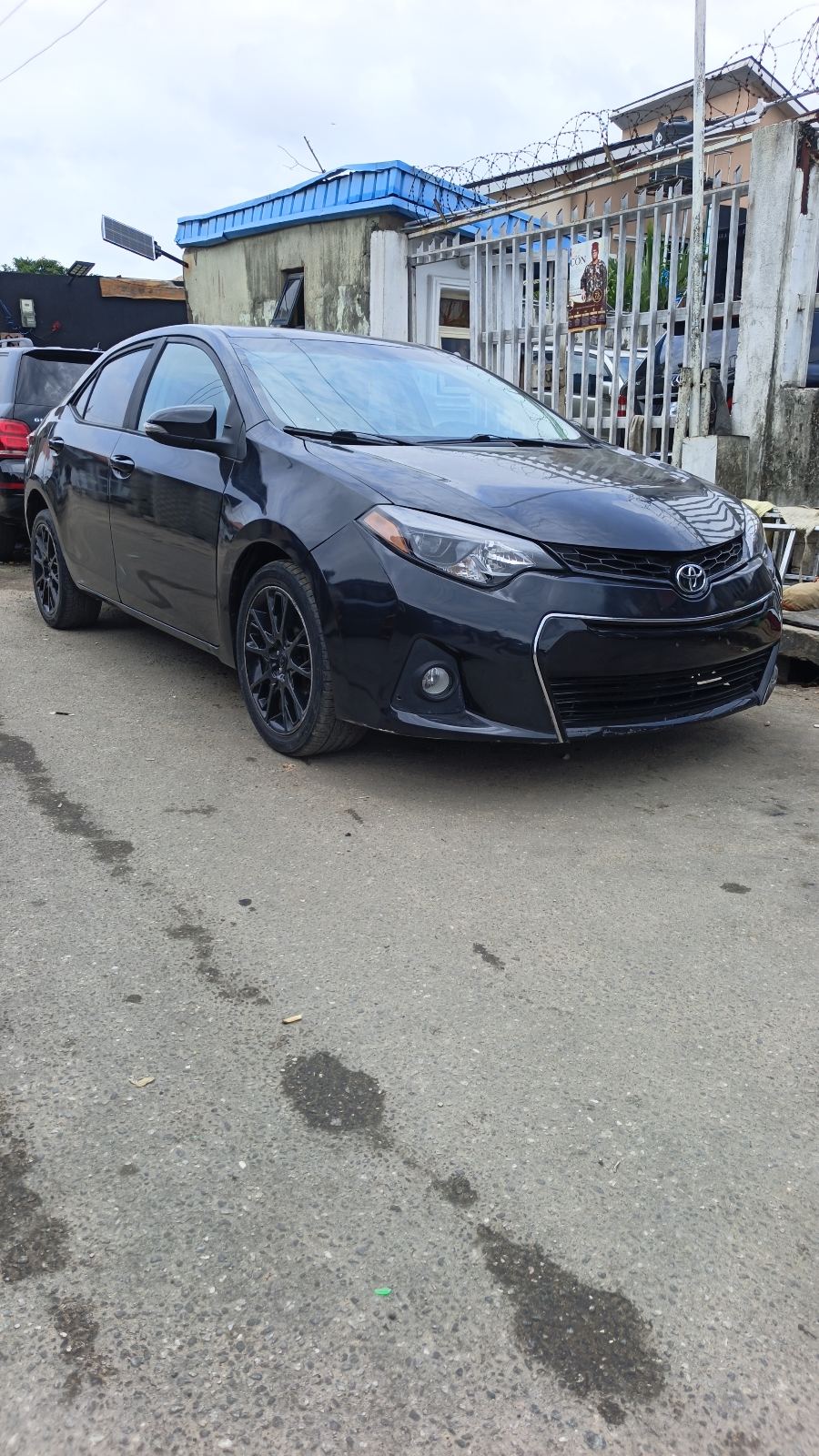 Toyota Corolla S Black Sedan with Alloy Wheels